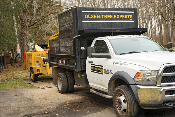 image of Olsen Tree Experts truck and wood chipper